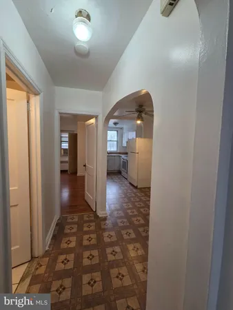 a view of a hallway view with wooden floor and staircase