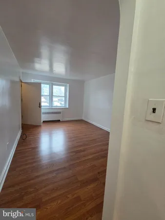 a view of room window and wooden floor
