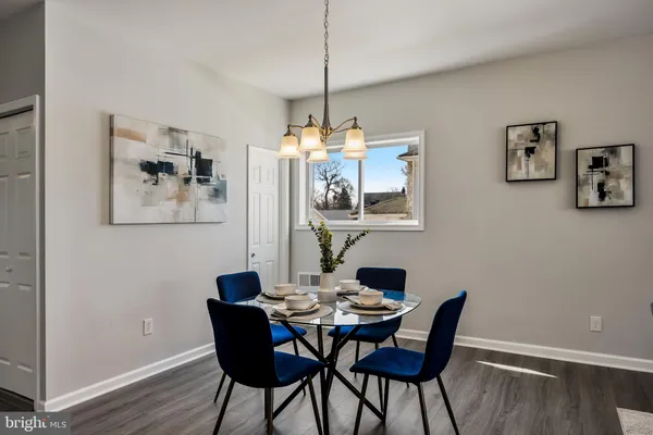 a dining room with furniture and window