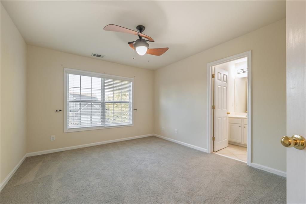 1280 Hidden Creek Point Cumming, GA 30040 - Photo 37 of 62 a view of an empty room with a window