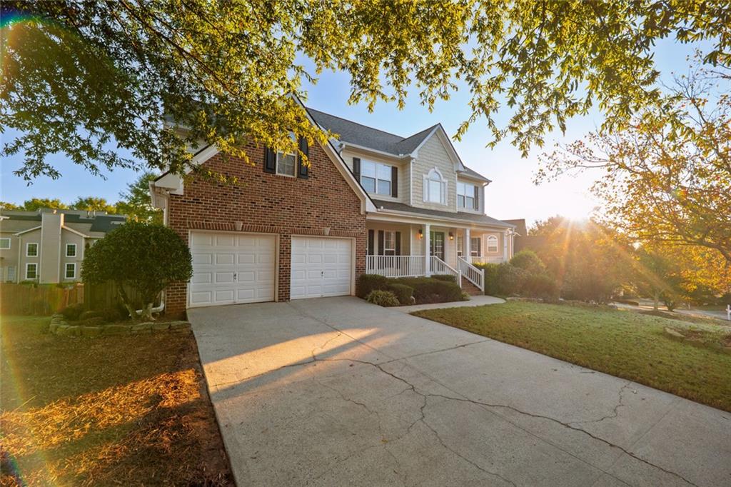 1280 Hidden Creek Point Cumming, GA 30040 - Photo 45 of 62 a front view of a house with a yard