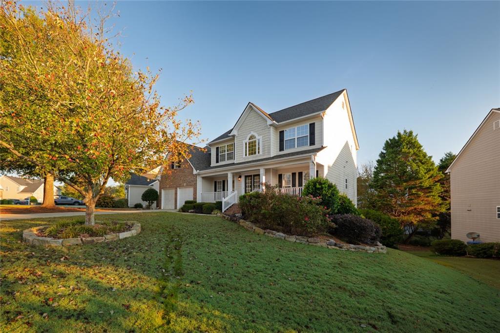 1280 Hidden Creek Point Cumming, GA 30040 - Photo 47 of 62 a front view of a house with garden