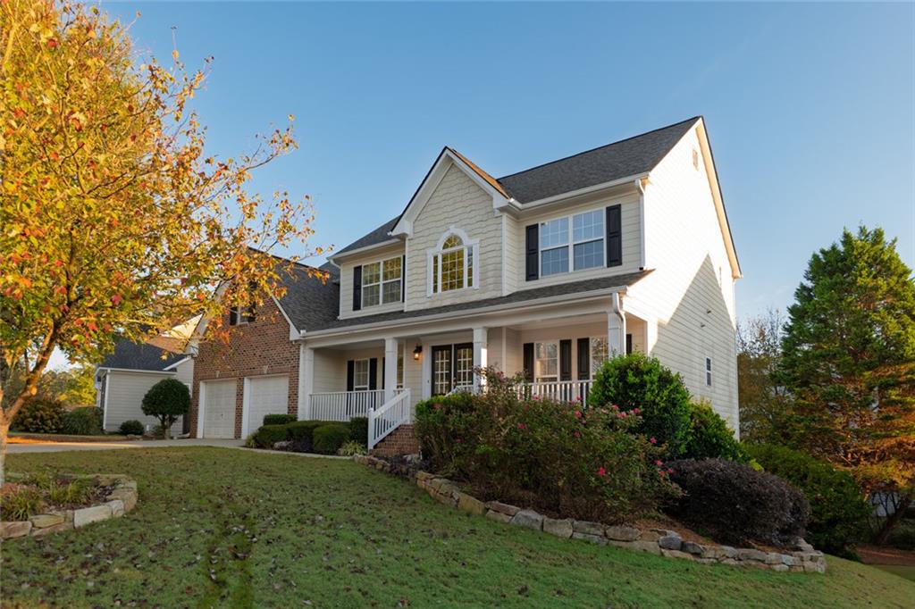 1280 Hidden Creek Point Cumming, GA 30040 - Photo 48 of 62 a front view of a house with a yard and garage
