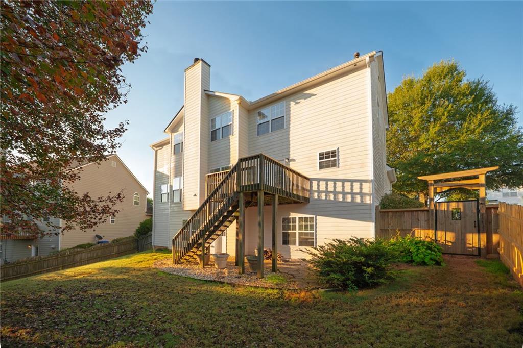 1280 Hidden Creek Point Cumming, GA 30040 - Photo 50 of 62 a front view of a house with a yard