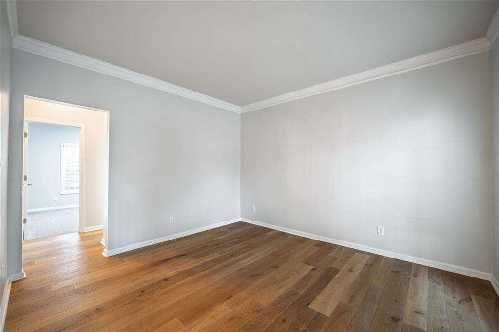 1280 Hidden Creek Point Cumming, GA 30040 - Photo 5 of 62 a view of an empty room with wooden floor