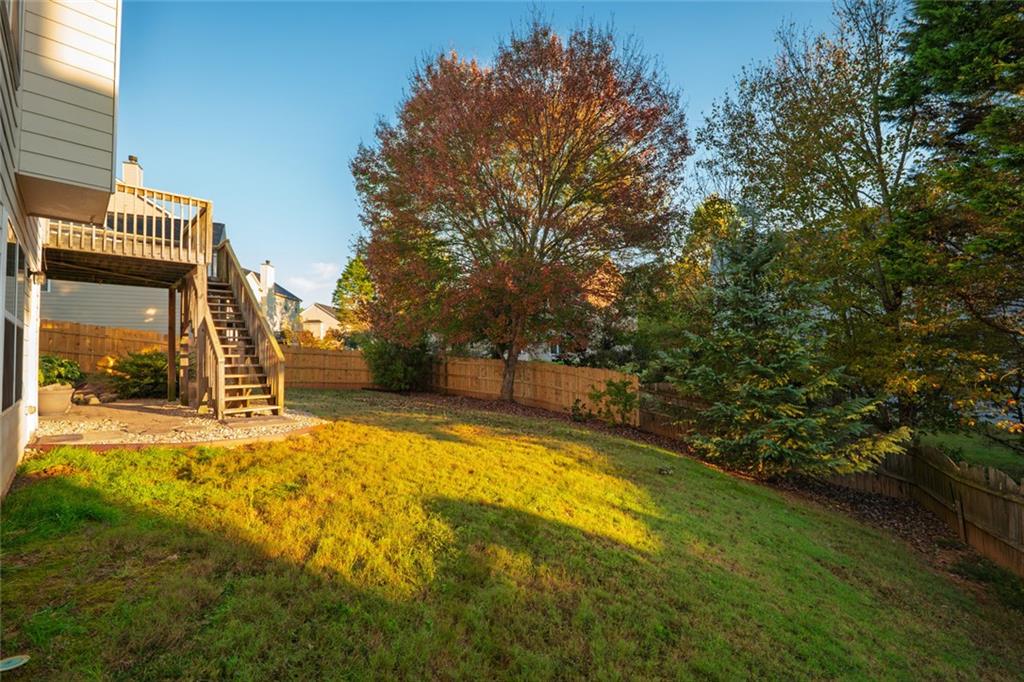 1280 Hidden Creek Point Cumming, GA 30040 - Photo 52 of 62 a view of swimming pool with yard and trees in the background
