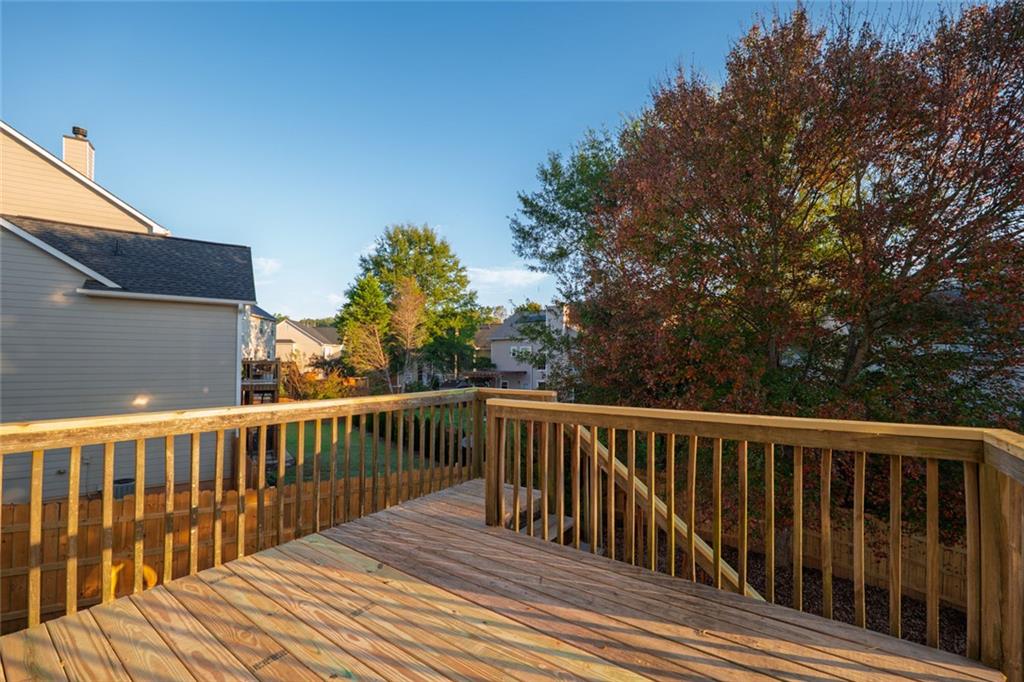 1280 Hidden Creek Point Cumming, GA 30040 - Photo 55 of 62 a balcony with wooden floor and fence