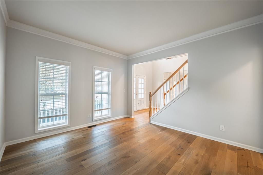 1280 Hidden Creek Point Cumming, GA 30040 - Photo 6 of 62 wooden floor in an empty room with a window