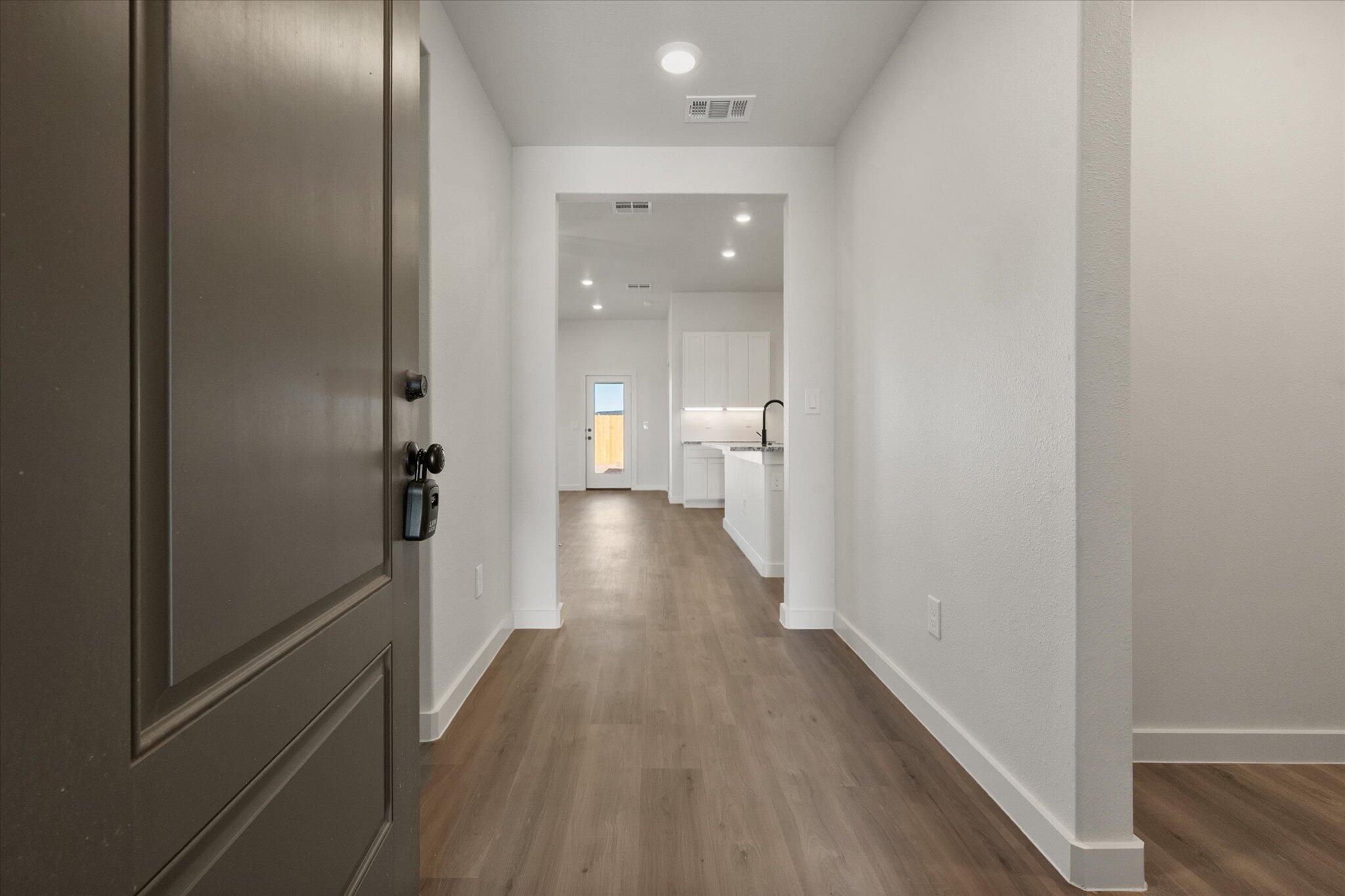 3114 138th Place Lubbock, TX 79423 - Photo 2 of 21 a view of a bathroom with a sink and a mirror