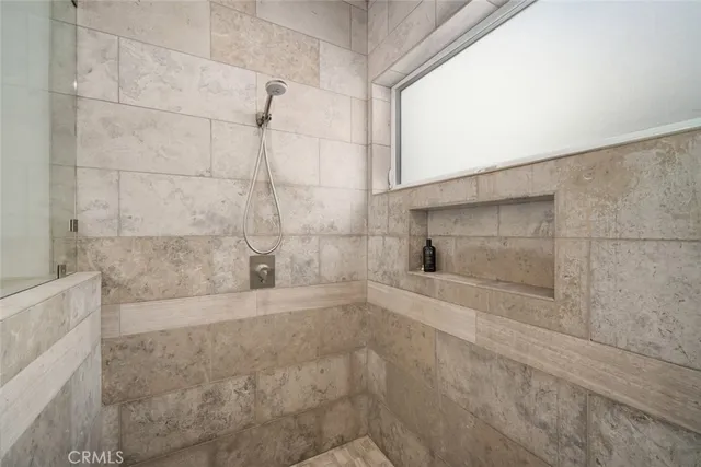 a bathroom with a bathtub and a shower