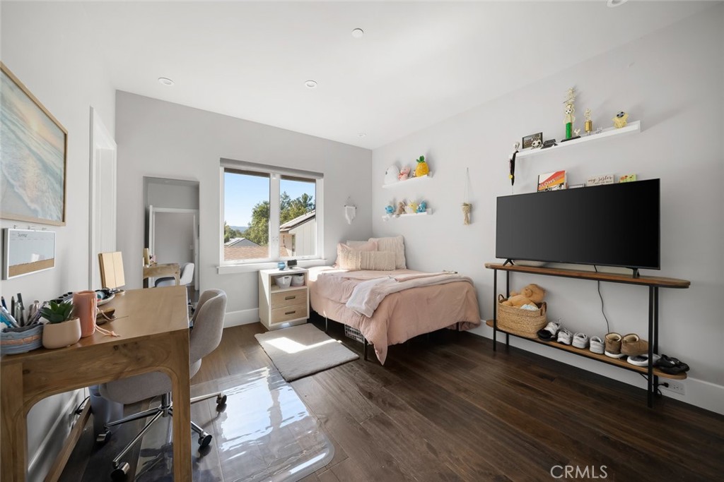 2207 San Luis Drive San Luis Obispo, CA 93401 - Photo 45 of 58 a bedroom with a bed and flat screen tv