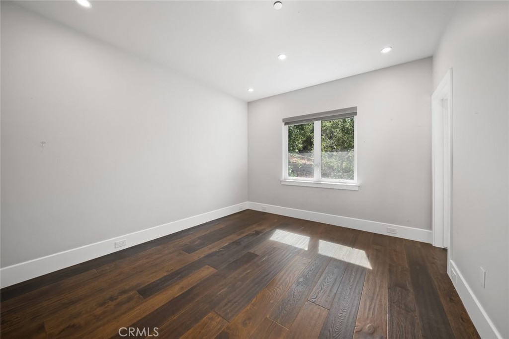 2207 San Luis Drive San Luis Obispo, CA 93401 - Photo 49 of 58 a view of empty room with wooden floor and fan