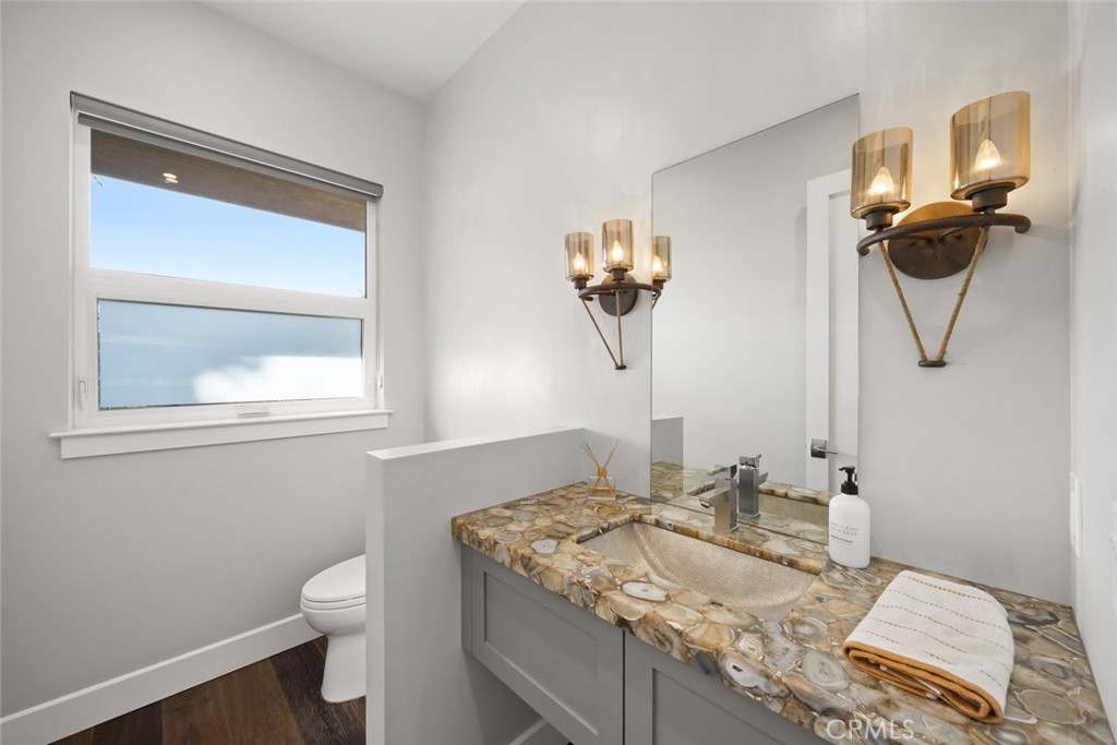 2207 San Luis Drive San Luis Obispo, CA 93401 - Photo 50 of 58 a bathroom with a granite countertop sink and a mirror