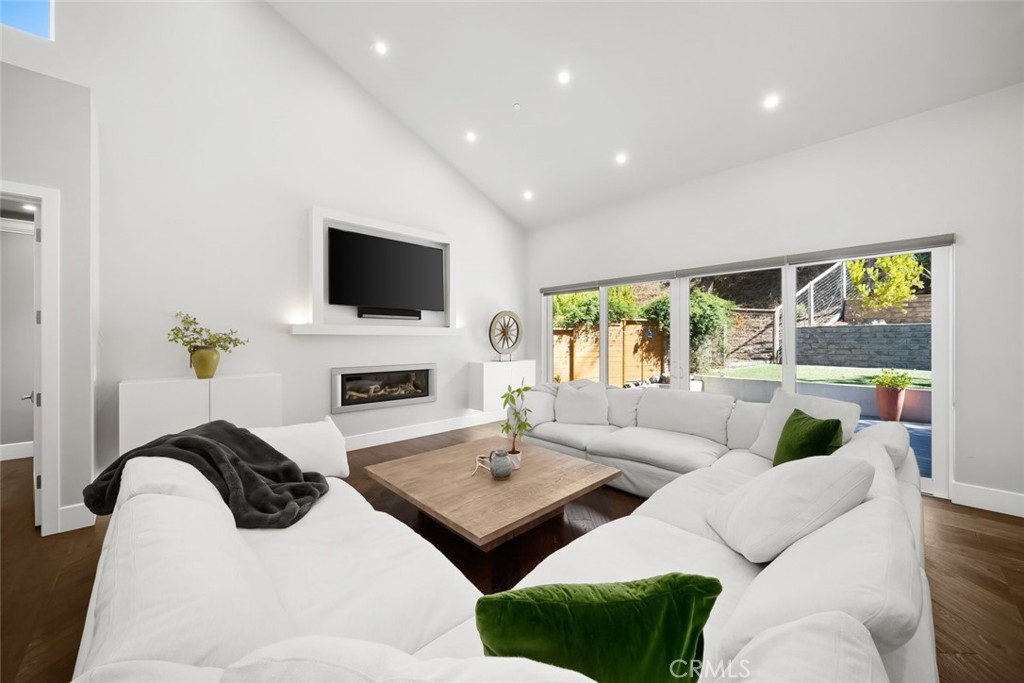 2207 San Luis Drive San Luis Obispo, CA 93401 - Photo 7 of 58 a living room with furniture a fireplace and a flat screen tv