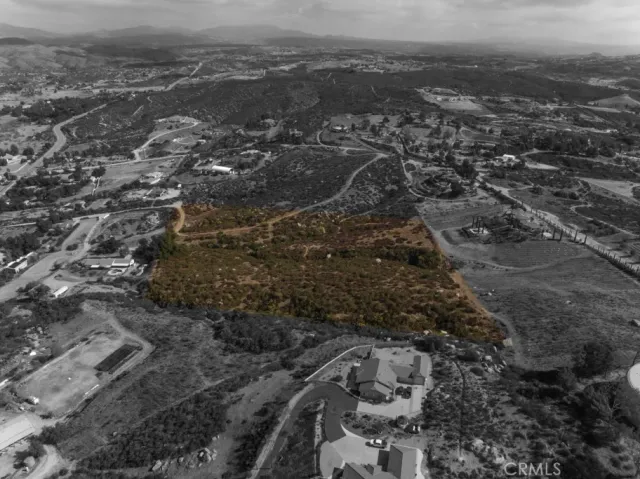an aerial view of house with yard