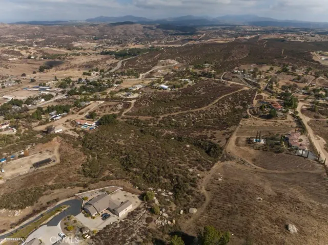 an aerial view of house with yard