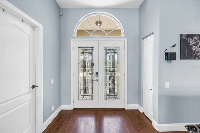 a view of an entryway with wooden floor