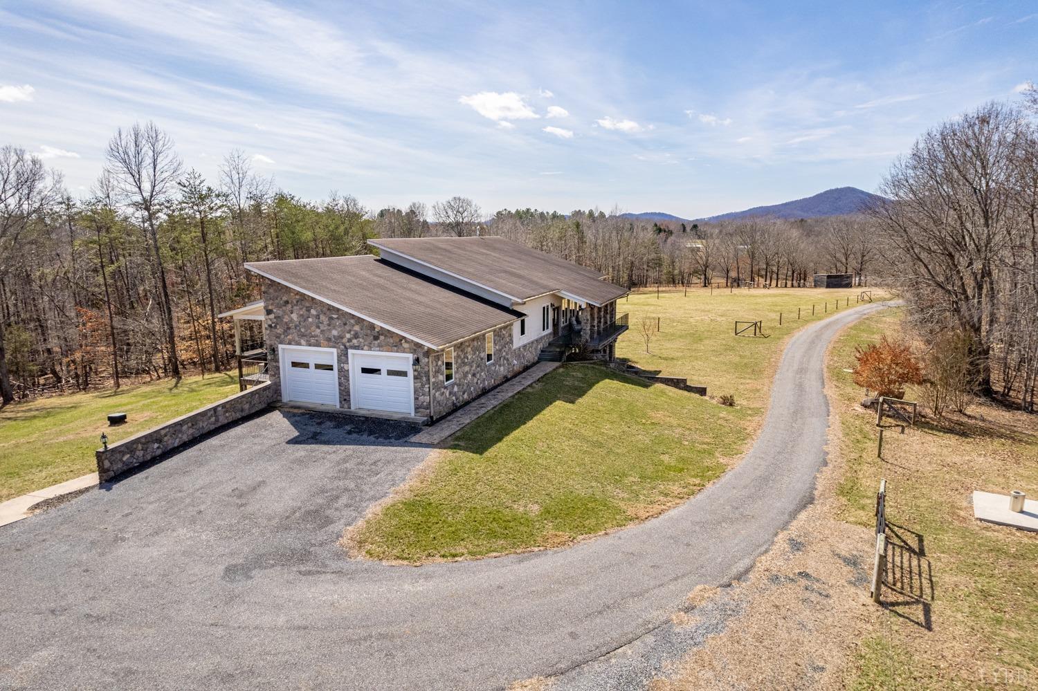 657 Cherry Hill Road Amherst, VA 24521 - Photo 11 of 91 a view of a house with a swimming pool and a yard