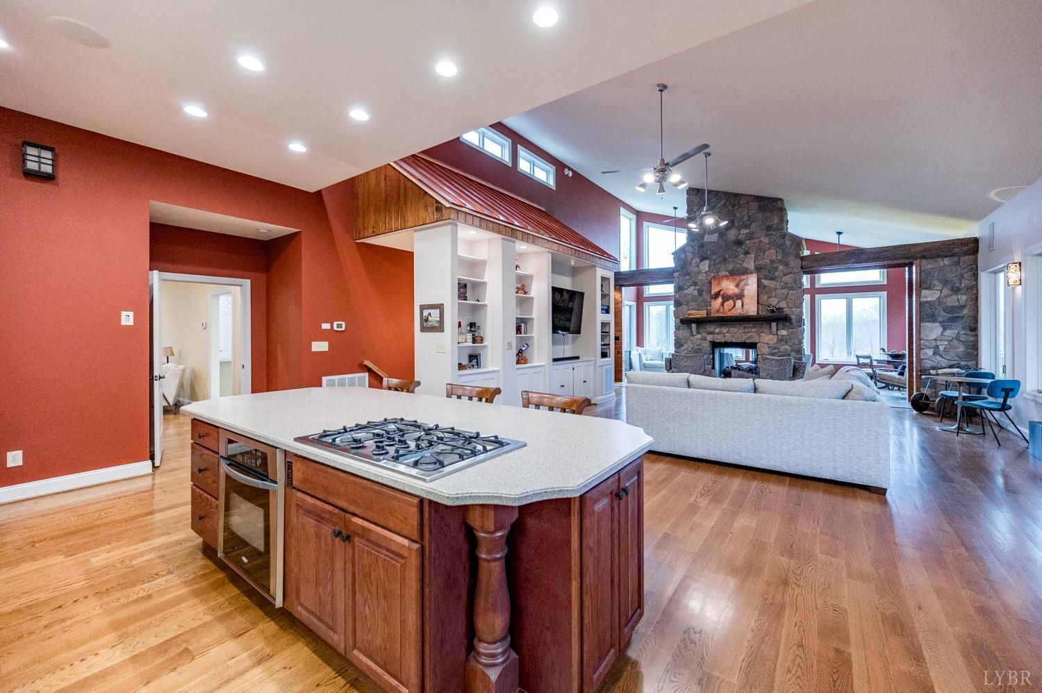 657 Cherry Hill Road Amherst, VA 24521 - Photo 23 of 91 a open kitchen with stainless steel appliances granite countertop a living room and a wooden floors