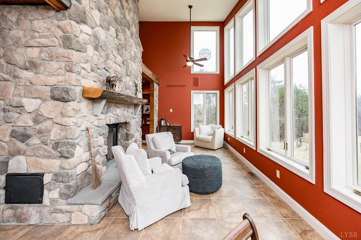 657 Cherry Hill Road Amherst, VA 24521 - Photo 25 of 91 a living room with fireplace furniture and a large window