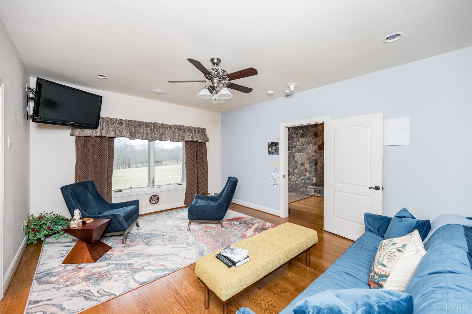 657 Cherry Hill Road Amherst, VA 24521 - Photo 29 of 91 a living room with furniture rug and window