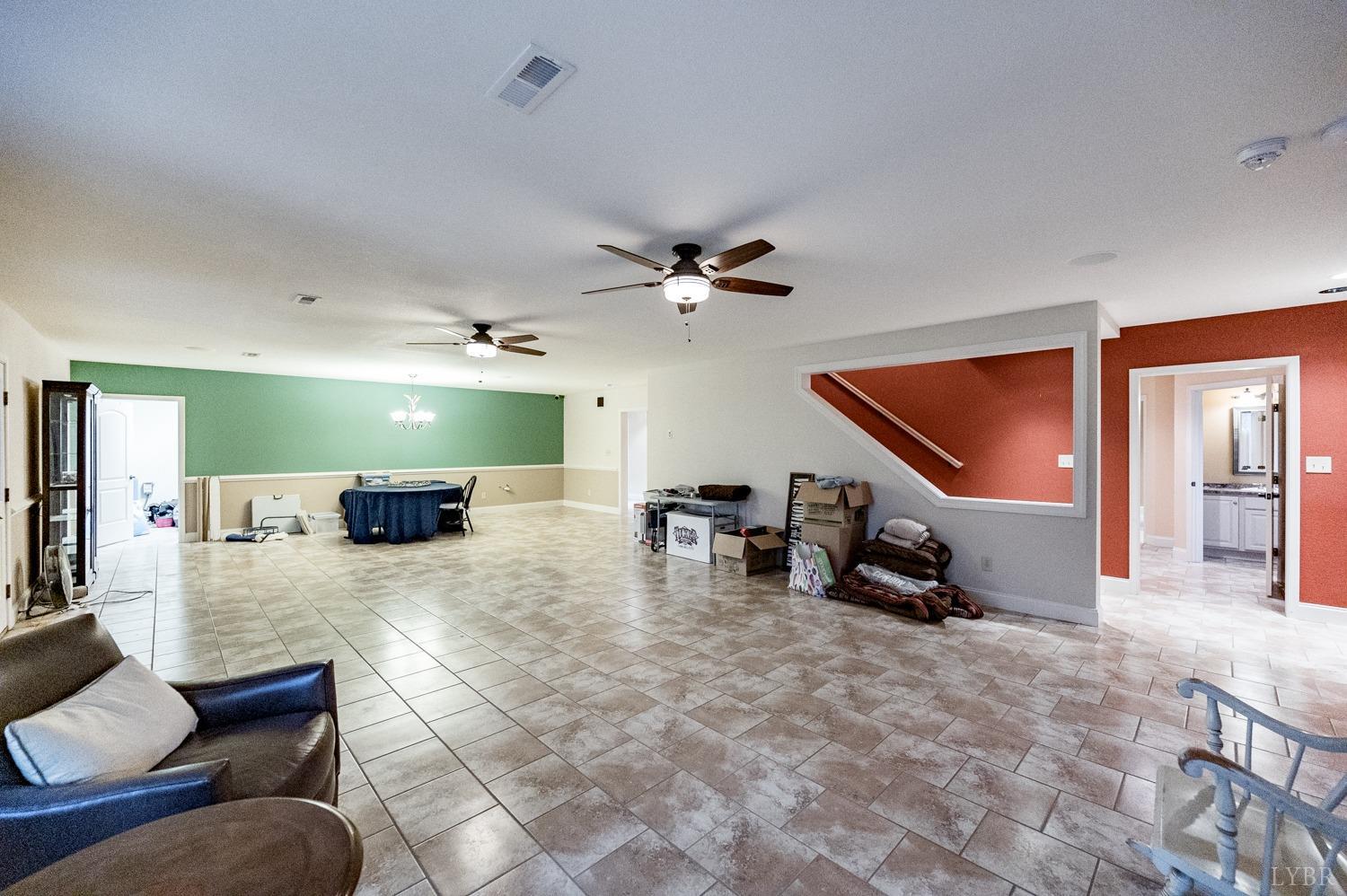 657 Cherry Hill Road Amherst, VA 24521 - Photo 39 of 91 a view of a livingroom with furniture and a flat screen tv