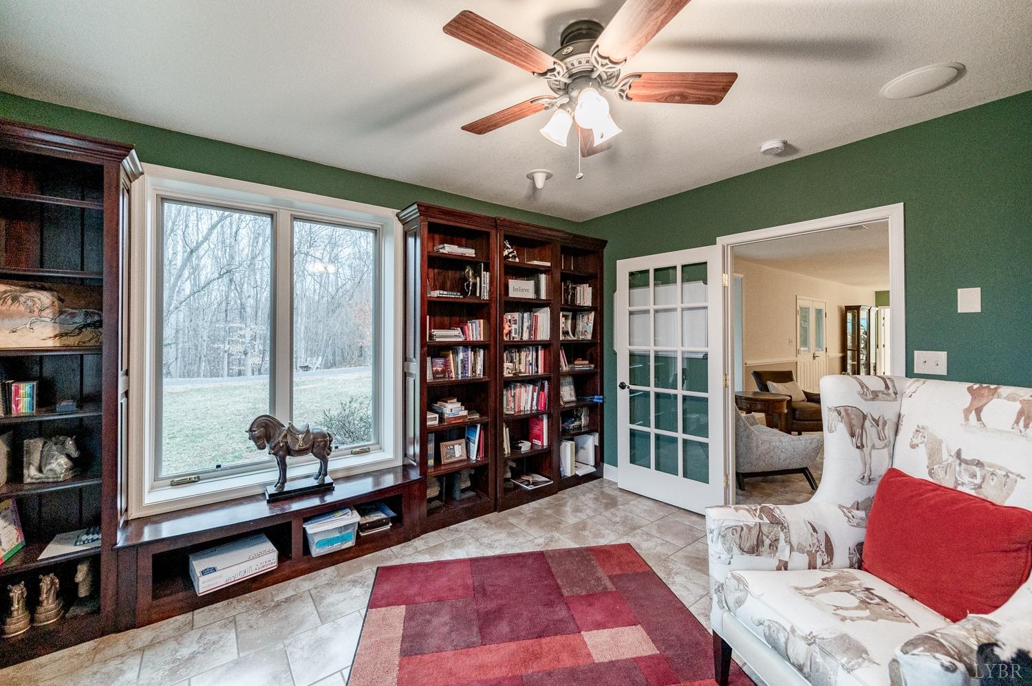 657 Cherry Hill Road Amherst, VA 24521 - Photo 42 of 91 a living room with furniture a rug and a large window
