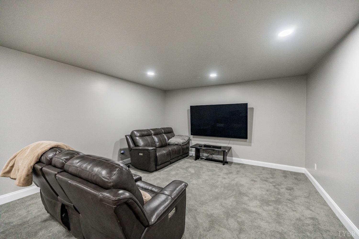 657 Cherry Hill Road Amherst, VA 24521 - Photo 47 of 91 a living room with furniture and a flat screen tv