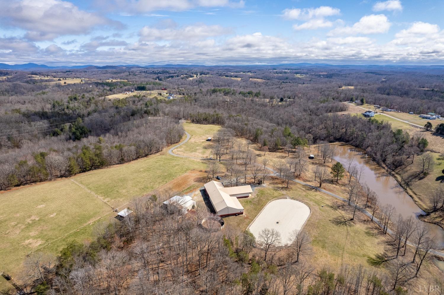 657 Cherry Hill Road Amherst, VA 24521 - Photo 10 of 91 a view of a lake with a mountain
