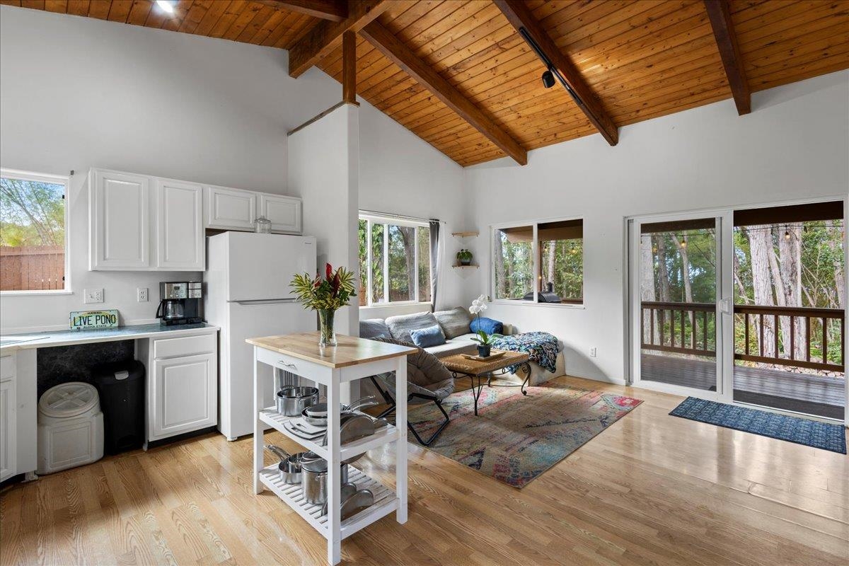 10 Poko Way, Unit B Haiku, HI 96708 - Photo 12 of 37 a living room with stainless steel appliances granite countertop furniture wooden floor and a window