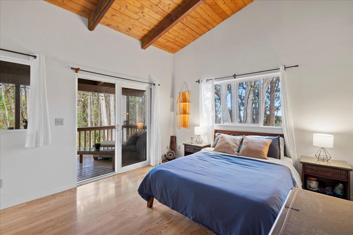 10 Poko Way, Unit B Haiku, HI 96708 - Photo 17 of 37 a bedroom with a large bed and a large window