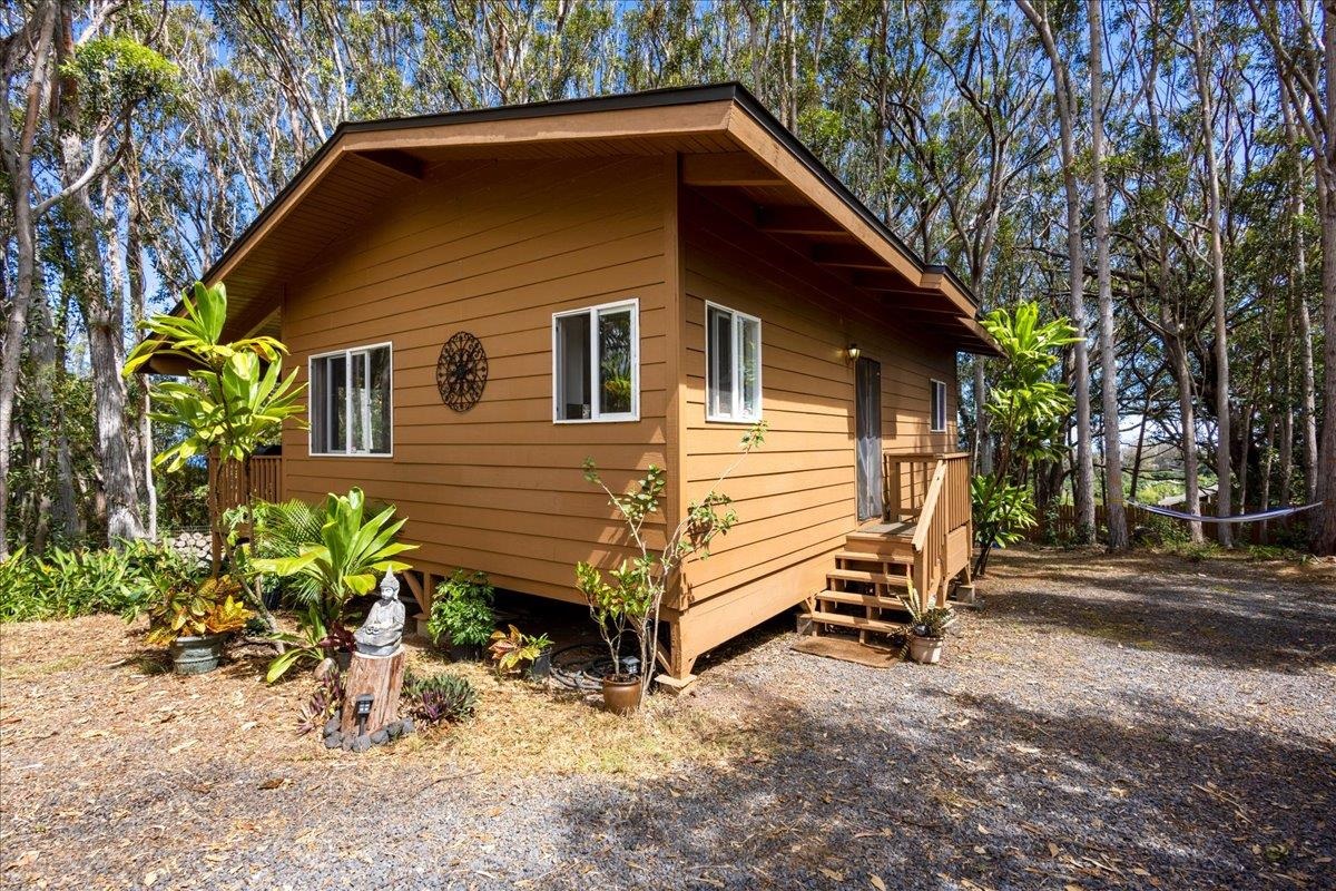 10 Poko Way, Unit B Haiku, HI 96708 - Photo 2 of 37 a view of a house with a yard chairs and a yard