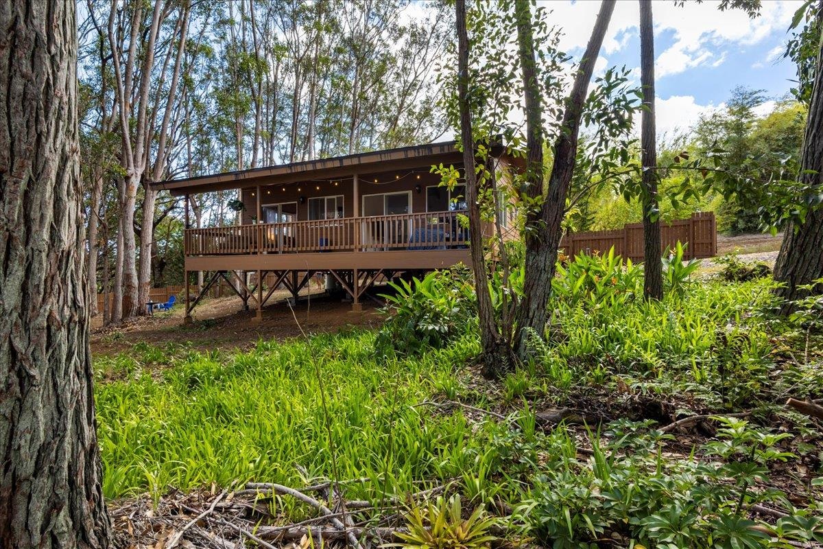 10 Poko Way, Unit B Haiku, HI 96708 - Photo 23 of 37 a view of a house with backyard and sitting area