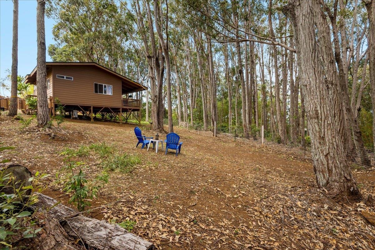 10 Poko Way, Unit B Haiku, HI 96708 - Photo 26 of 37 a backyard of a house with barbeque oven table and chairs