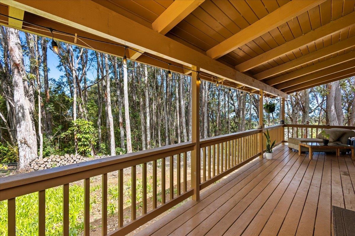 10 Poko Way, Unit B Haiku, HI 96708 - Photo 7 of 37 a view of balcony with couch and wooden floor