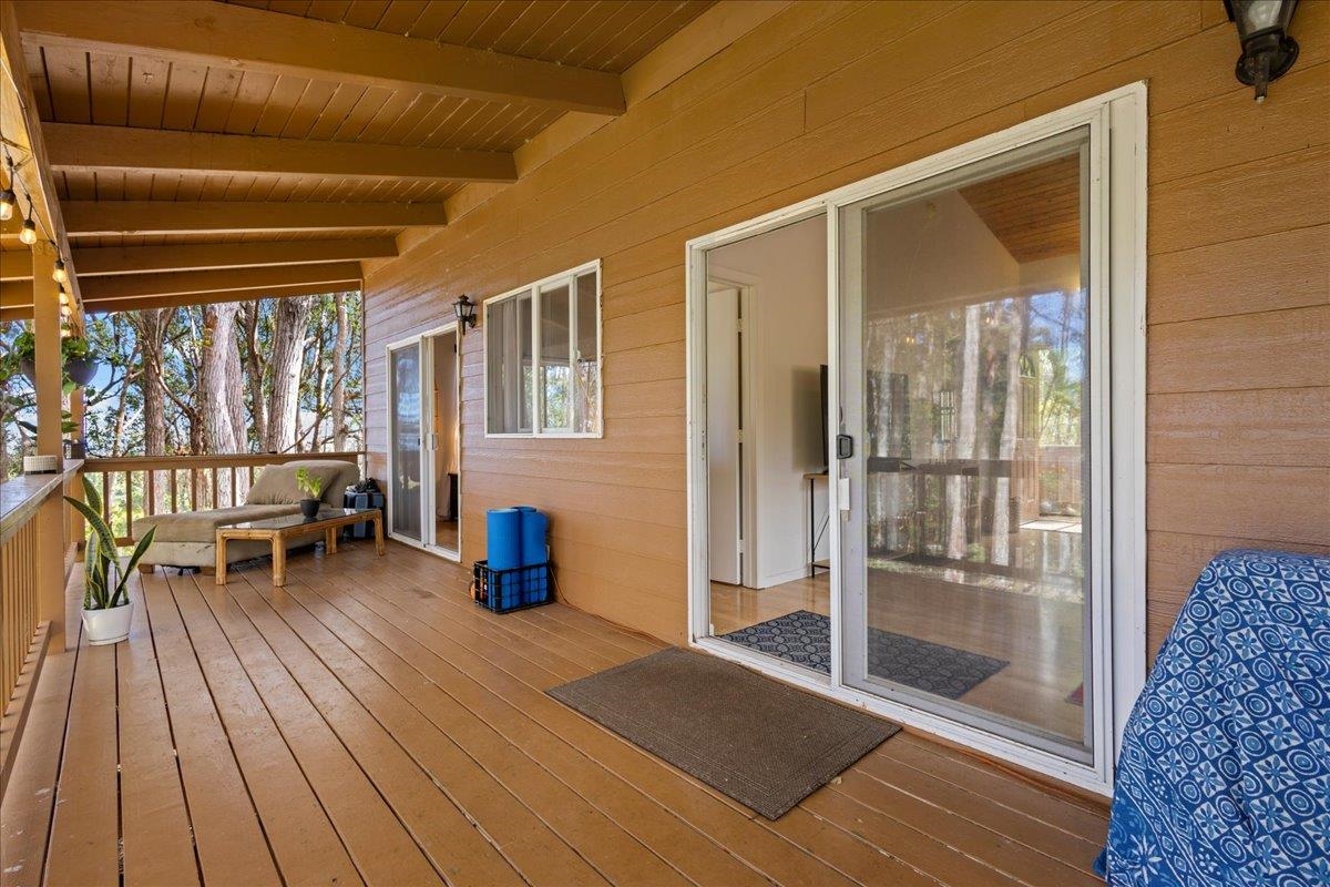 10 Poko Way, Unit B Haiku, HI 96708 - Photo 10 of 37 a bedroom with wooden floor and furniture