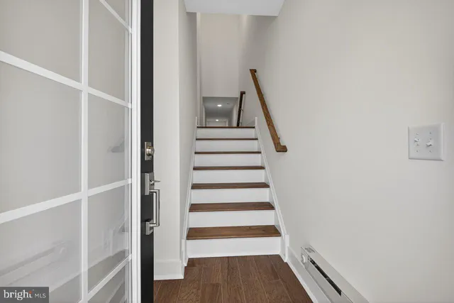 a view of entryway with wooden floor