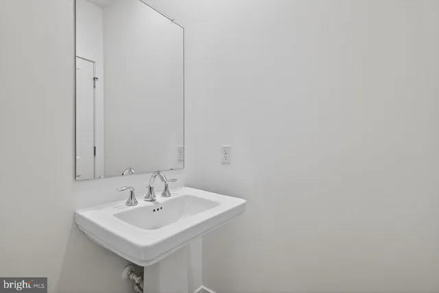 a white sink sitting next to a white sink