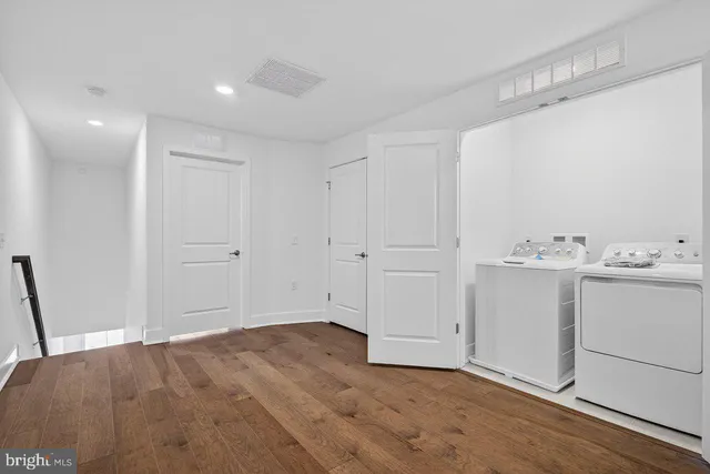 a view of a room with closet and wooden floor