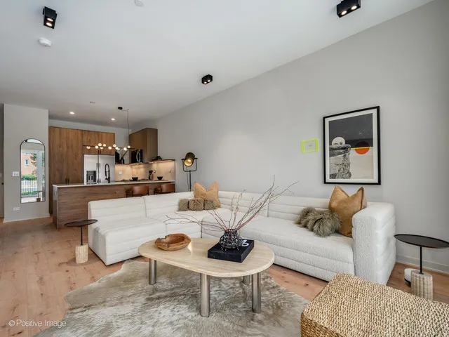 a kitchen with stainless steel appliances a sink a stove and a refrigerator