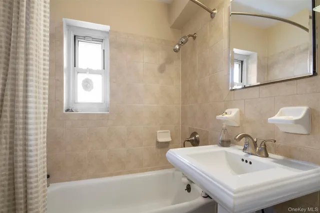 a bathroom with a sink and a bathtub