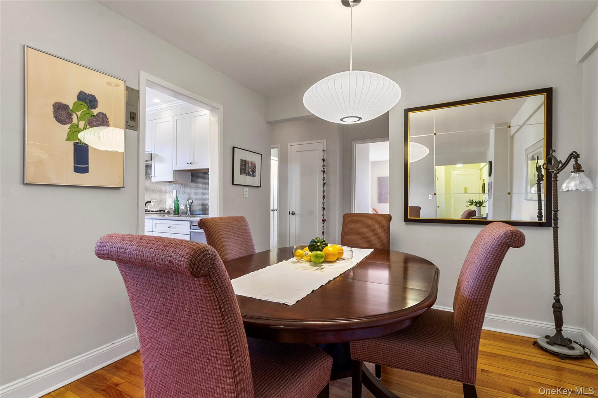 565 Broadway, Unit 4A Hastings-on-Hudson, NY 10706 - Photo 9 of 19 a view of a dining room with furniture window and wooden floor