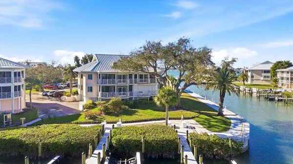 an aerial view of a house with a lake view