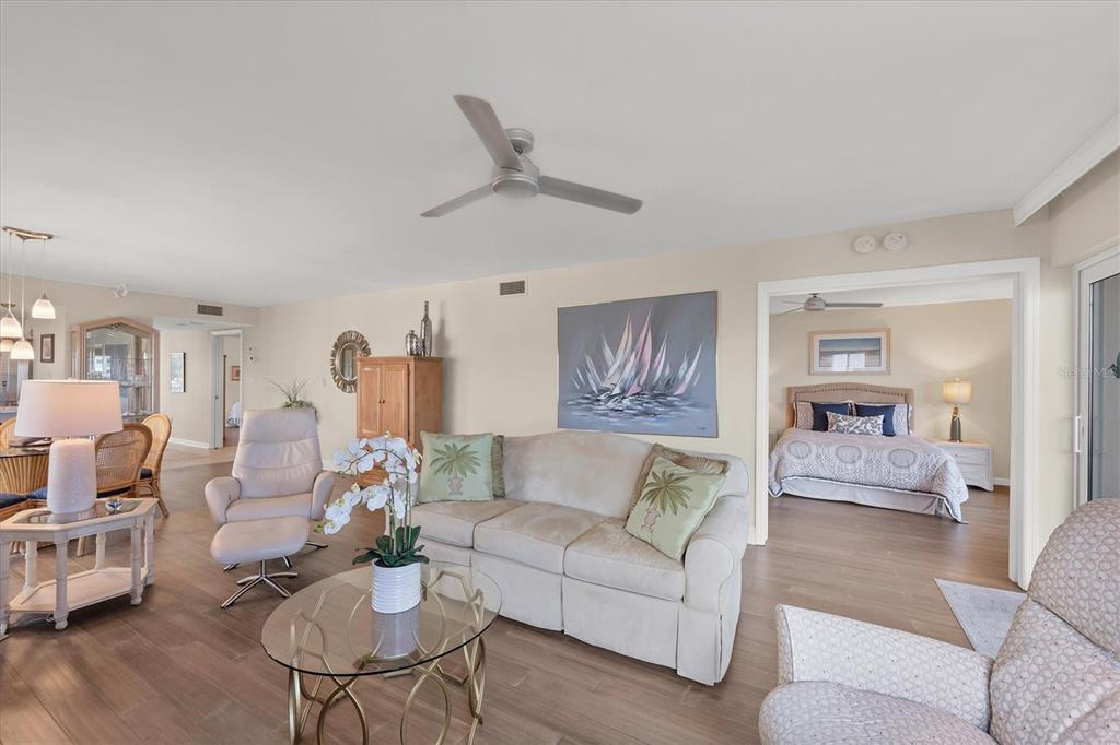 11000 Placida Road, Unit 702 Placida, FL 33946 - Photo 11 of 60 a living room with furniture and a wooden floor