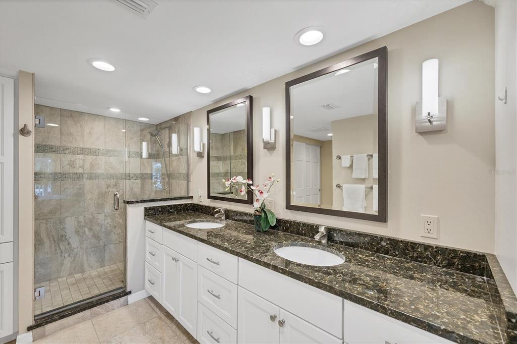 11000 Placida Road, Unit 702 Placida, FL 33946 - Photo 21 of 60 a bathroom with a granite countertop sink and a mirror