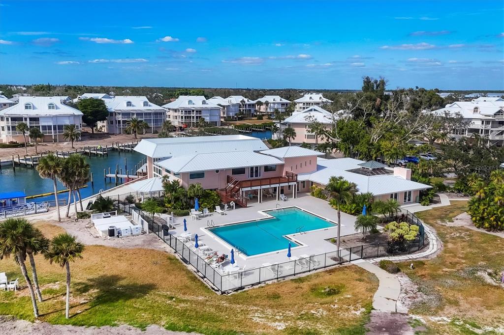 11000 Placida Road, Unit 702 Placida, FL 33946 - Photo 41 of 60 an aerial view of a house with a swimming pool outdoor seating and yard