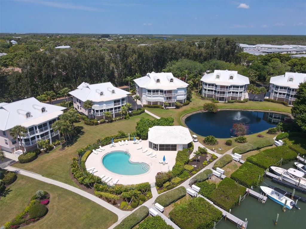 11000 Placida Road, Unit 702 Placida, FL 33946 - Photo 53 of 60 an aerial view of a house with swimming pool and outdoor seating