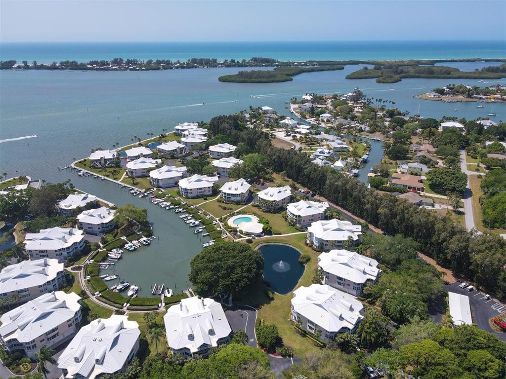 11000 Placida Road, Unit 702 Placida, FL 33946 - Photo 54 of 60 an aerial view of a house with a lake view