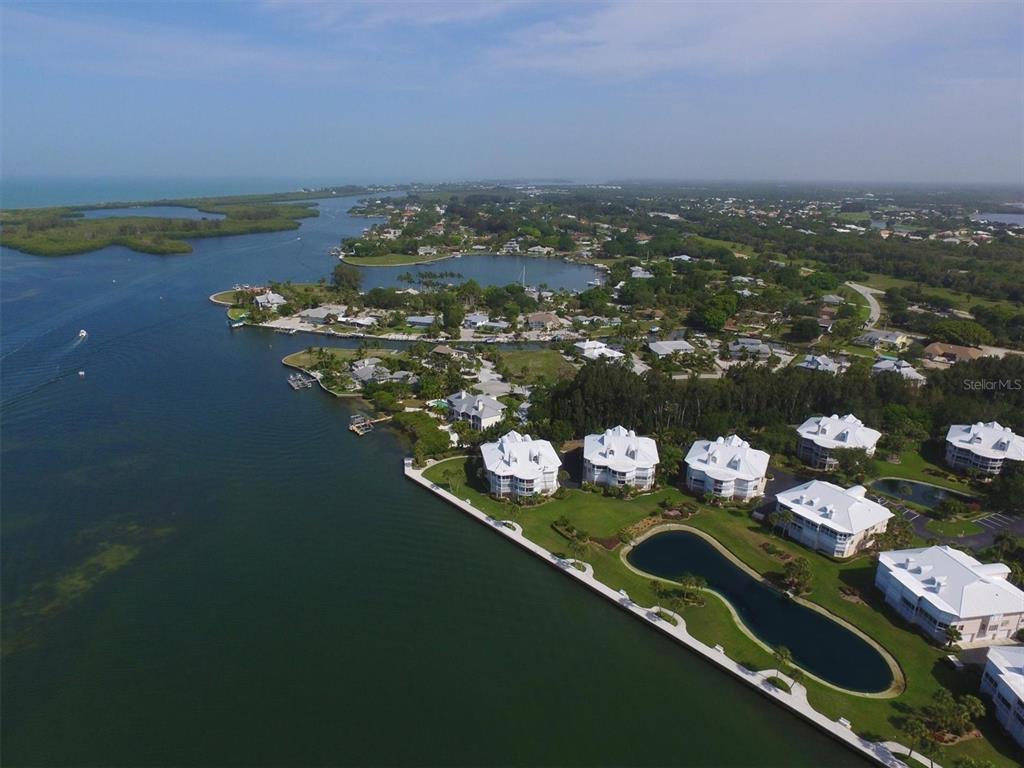 11000 Placida Road, Unit 702 Placida, FL 33946 - Photo 59 of 60 an aerial view of a house with a lake view