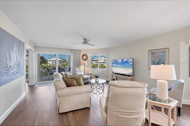 a bedroom with two beds and a chandelier